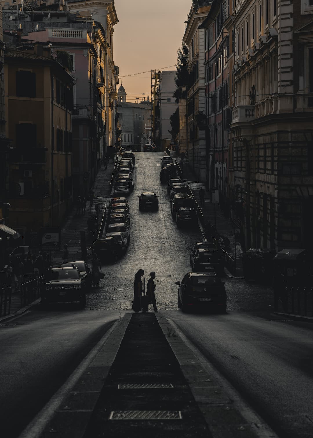 Silhouettes crossing Rome streets